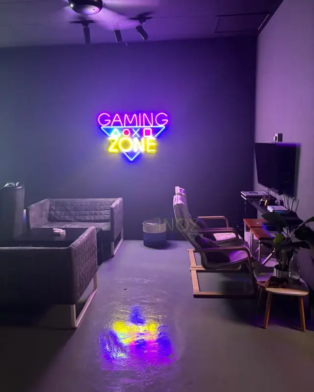 The gaming corner under the neon Gaming Zone sign.