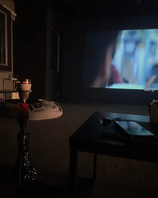 A shisha in front of the big screen during a film.